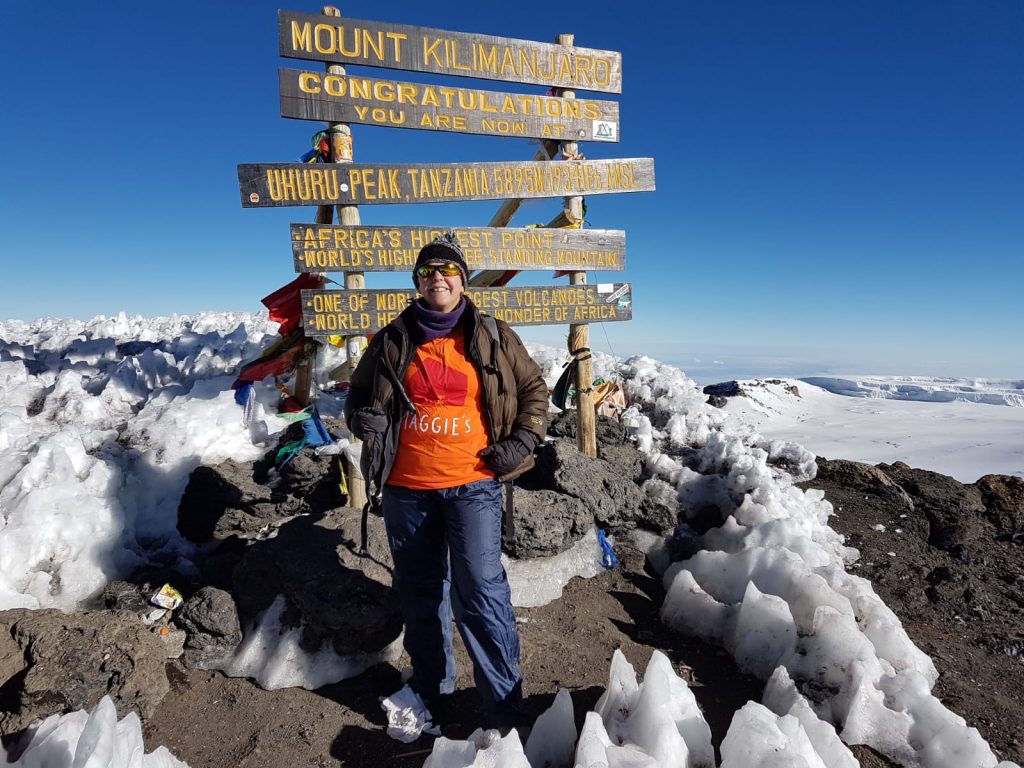 Tina at the Summit of Kilimanjaro in her Maggie’s T Shirt
